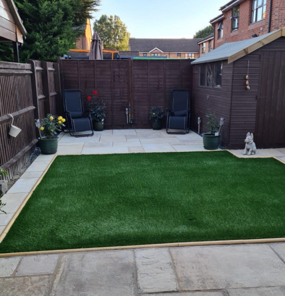 Artifical lawn with Shed and Statue of a dog